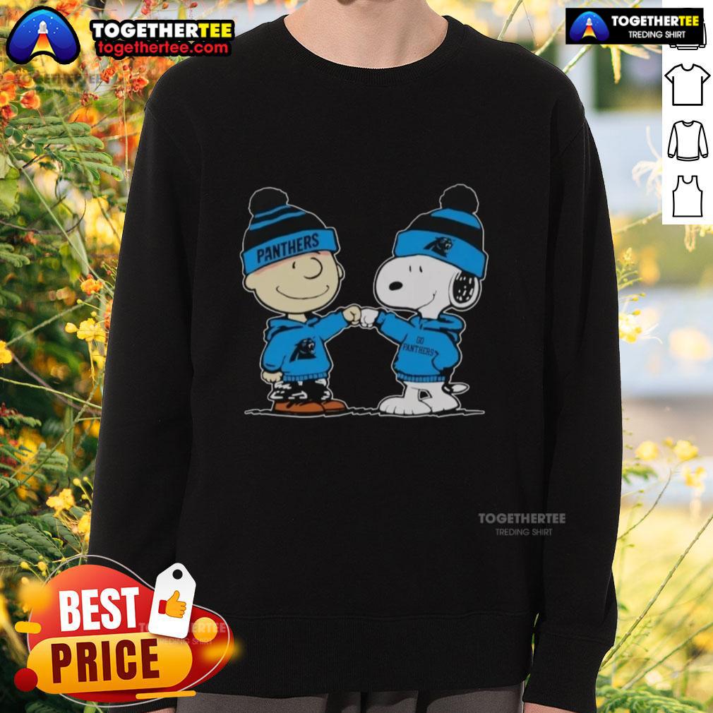 Alt Text: Cozy sweatshirt featuring Snoopy and Charlie Brown, perfect for Carolina Panthers fans and best friends.