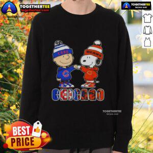 Official Charlie Brown fist bump with Snoopy on Chicago City Sports Cubs X Bears sweatshirt, perfect for fans.