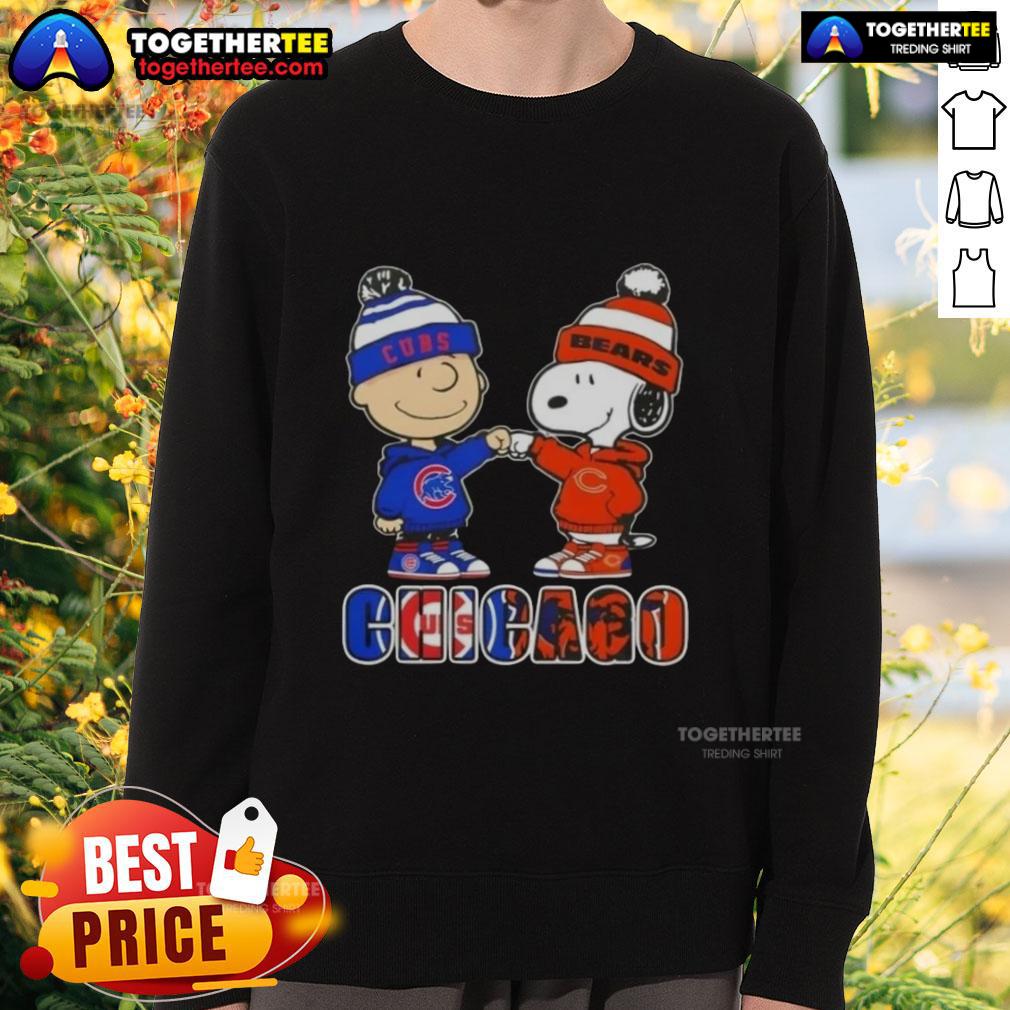 Official Charlie Brown fist bump with Snoopy on Chicago City Sports Cubs X Bears sweatshirt, perfect for fans.