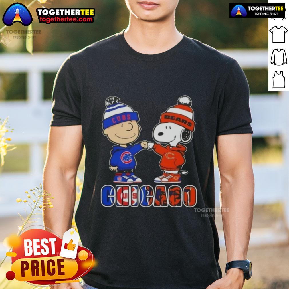 Official Charlie Brown fist bump with Snoopy on Chicago Cubs and Bears T-shirt, perfect for sports fans.