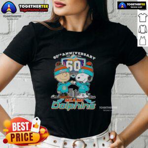 Original Charlie Brown fist bump with Snoopy, celebrating 60th Anniversary 1965-2025, featuring Miami Dolphins skyline on ladies tee.