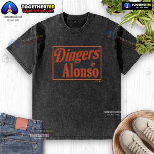 Alt Text: Original Pete Alonso Baltimore Dingers sign on a washed t-shirt, showcasing MLB fan merchandise.