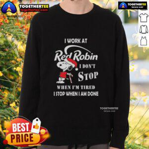 Snoopy Christmas sweatshirt featuring 'I work at Red Robin, I don't stop when I'm tired, I stop when I'm done' slogan.