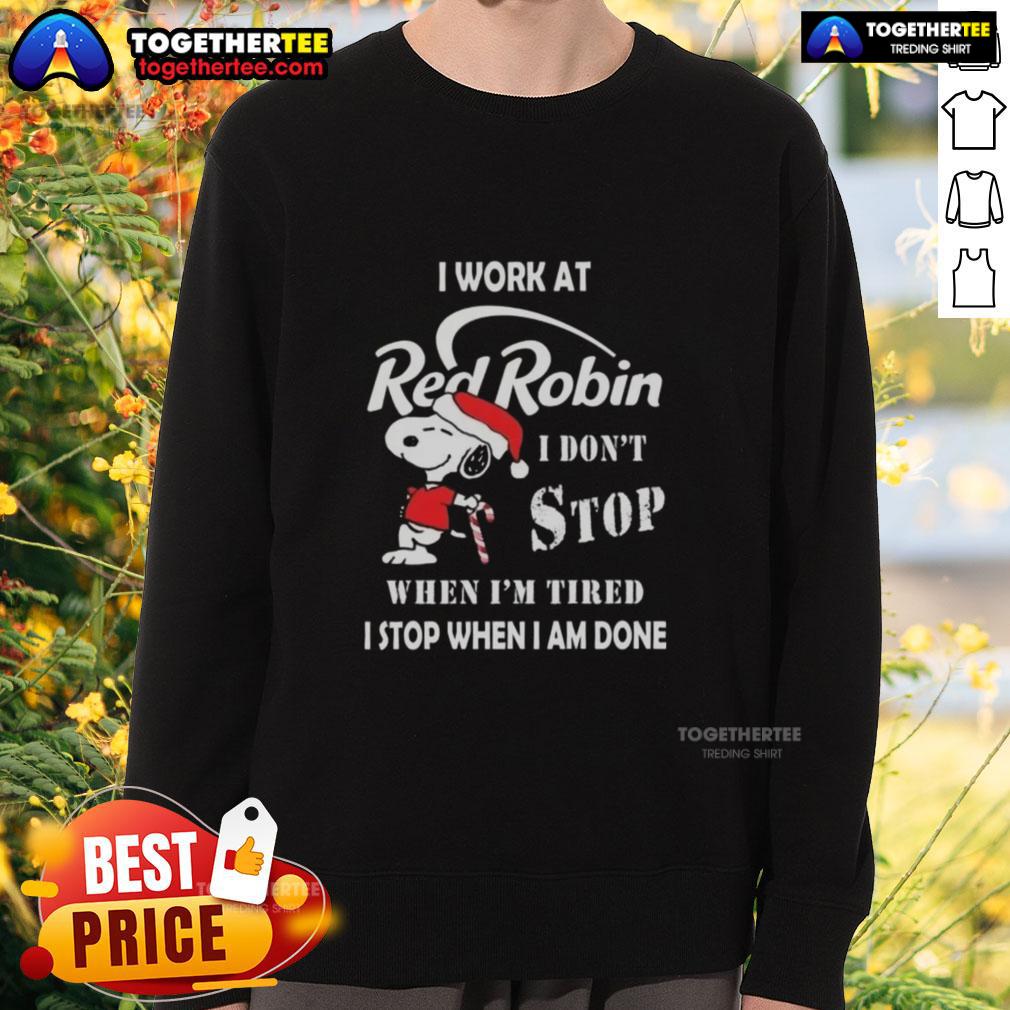 Snoopy Christmas sweatshirt featuring 'I work at Red Robin, I don't stop when I'm tired, I stop when I'm done' slogan.