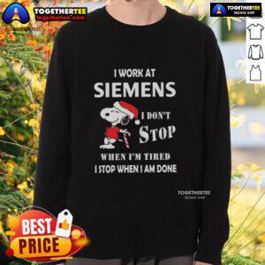 Alt Text: Festive Christmas sweatshirt featuring Snoopy with 'I work at Siemens, I don't stop when I'm tired, I stop when I'm done.'