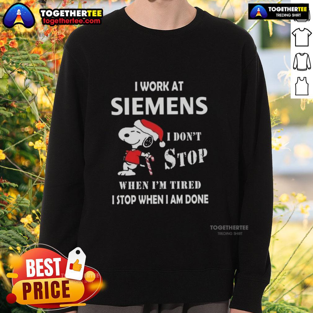 Alt Text: Festive Christmas sweatshirt featuring Snoopy with 'I work at Siemens, I don't stop when I'm tired, I stop when I'm done.'