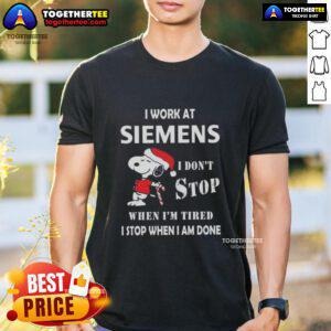 Alt Text: Top Snoopy Christmas T-Shirt featuring 'I Work At Siemens I Don'T Stop When I'M Tired I Stop When I Am Done' slogan.