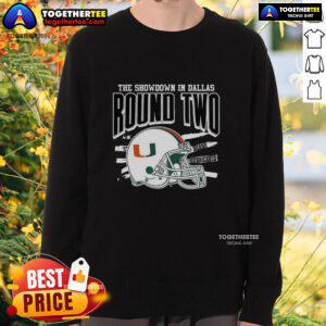 Alt Text: Official Miami Hurricanes NCAA CFP The Showdown in Dallas Round Two helmet sweatshirt, featuring team colors and logo.