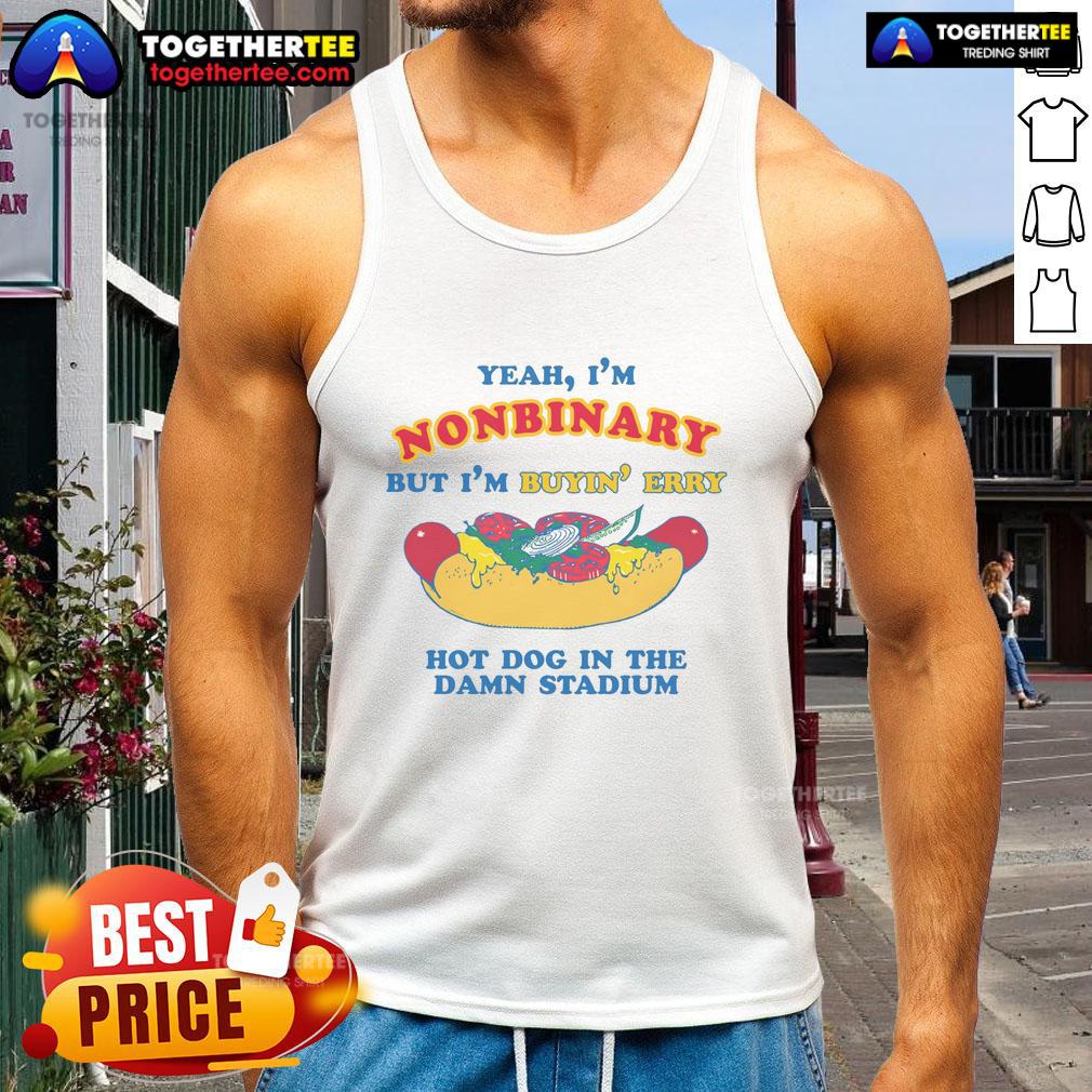 Nonbinary person in a stadium tank top happily buying hot dogs, showcasing pride and fun in their identity.