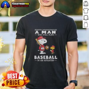 Alt Text: Peanuts X St Louis Cardinals t-shirt featuring 'Never Underestimate A Man Who Plays Baseball In His Seventies' design.
