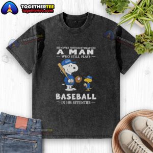 Alt Text: Nice the Peanuts X Texas Rangers 'Never Underestimate a Man Who Still Plays Baseball in His Seventies' washed t-shirt.