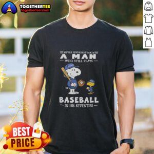 Nice The Peanuts X Toronto Blue Jays T-Shirt: 'Never Underestimate A Man Who Still Plays Baseball In His Seventies' design.