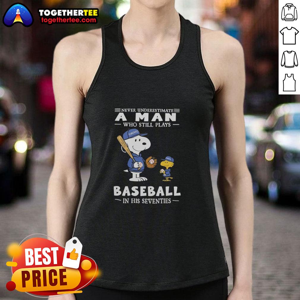 Man in his seventies wearing a Nice The Peanuts x Toronto Blue Jays tank top, showcasing baseball spirit and style.