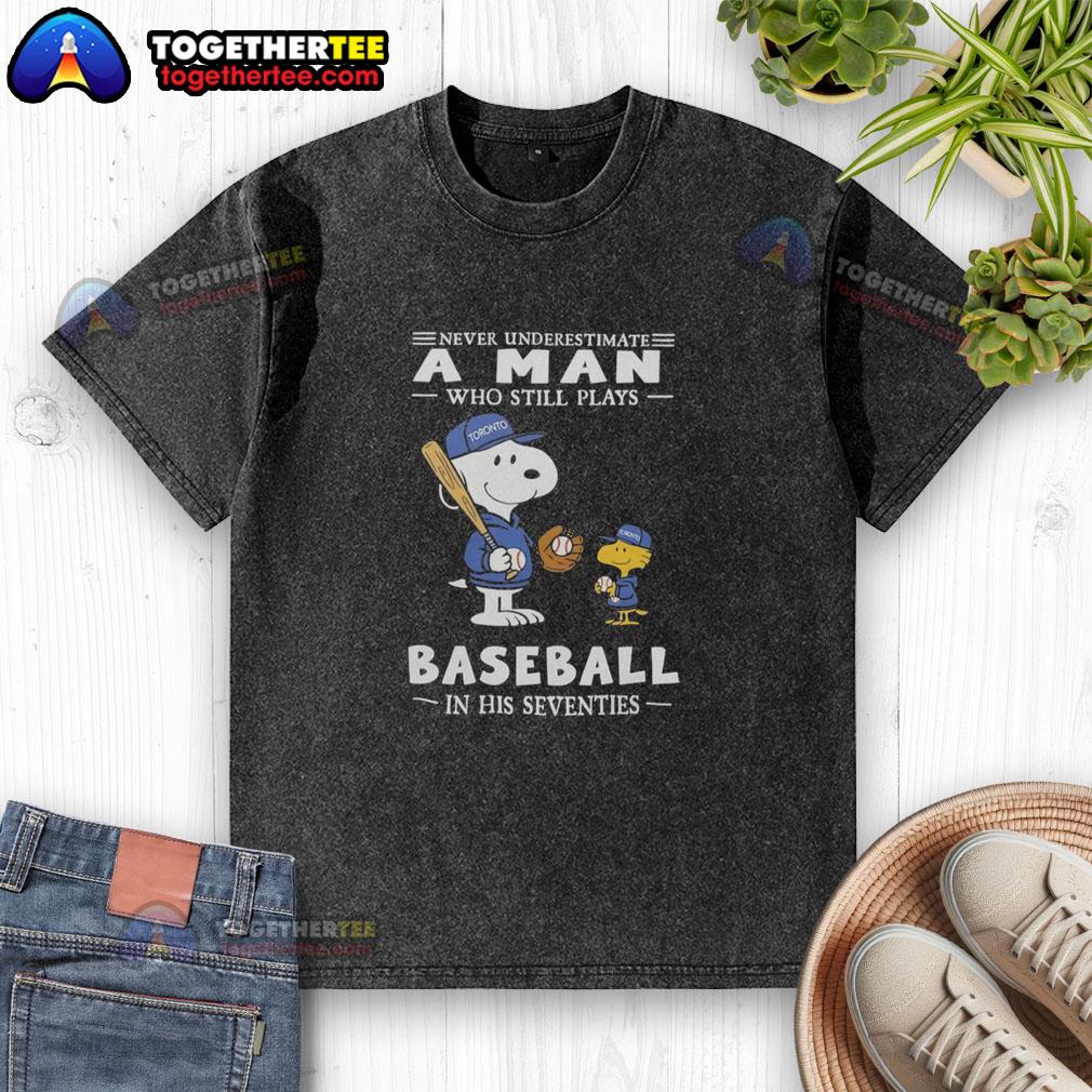 Alt Text: Nice washed t-shirt featuring Peanuts x Toronto Blue Jays design: 'Never underestimate a man who plays baseball in his seventies.'