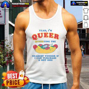 Person wearing a 'Nice Yeah, I'm Queer' tank top, searching for a hot dog vendor at a vibrant outdoor market.