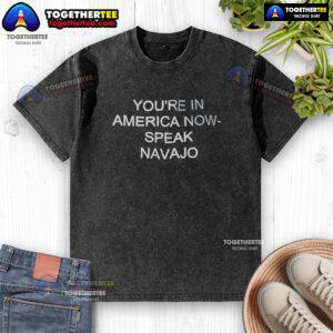 Alt Text: Official You're In America Now Speak Navajo washed t-shirt featuring a stylish design and vibrant colors.