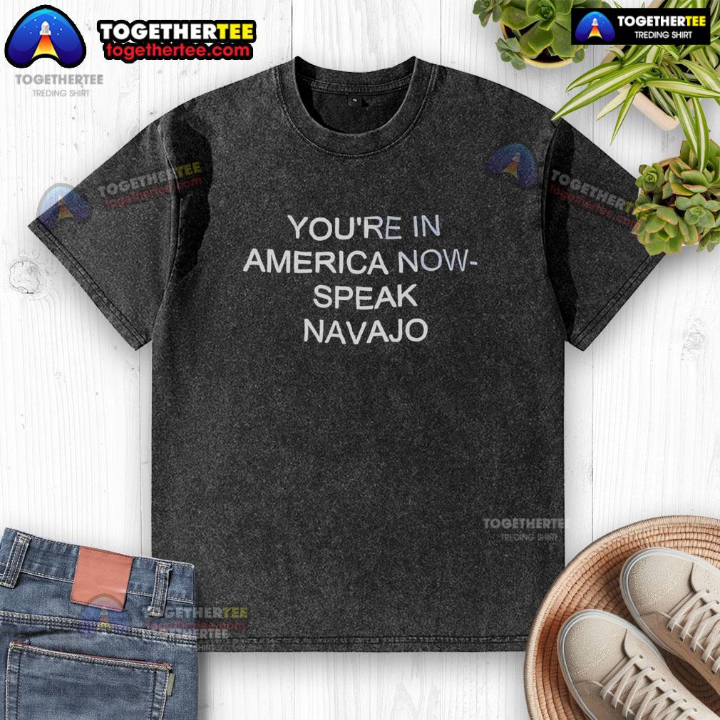 Alt Text: Official You're In America Now Speak Navajo washed t-shirt featuring a stylish design and vibrant colors.