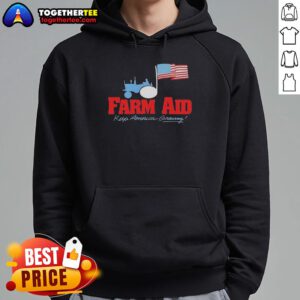 Alt Text: Premium Farm Aid hoodie featuring a tractor logo and American flag, symbolizing support for American farmers.