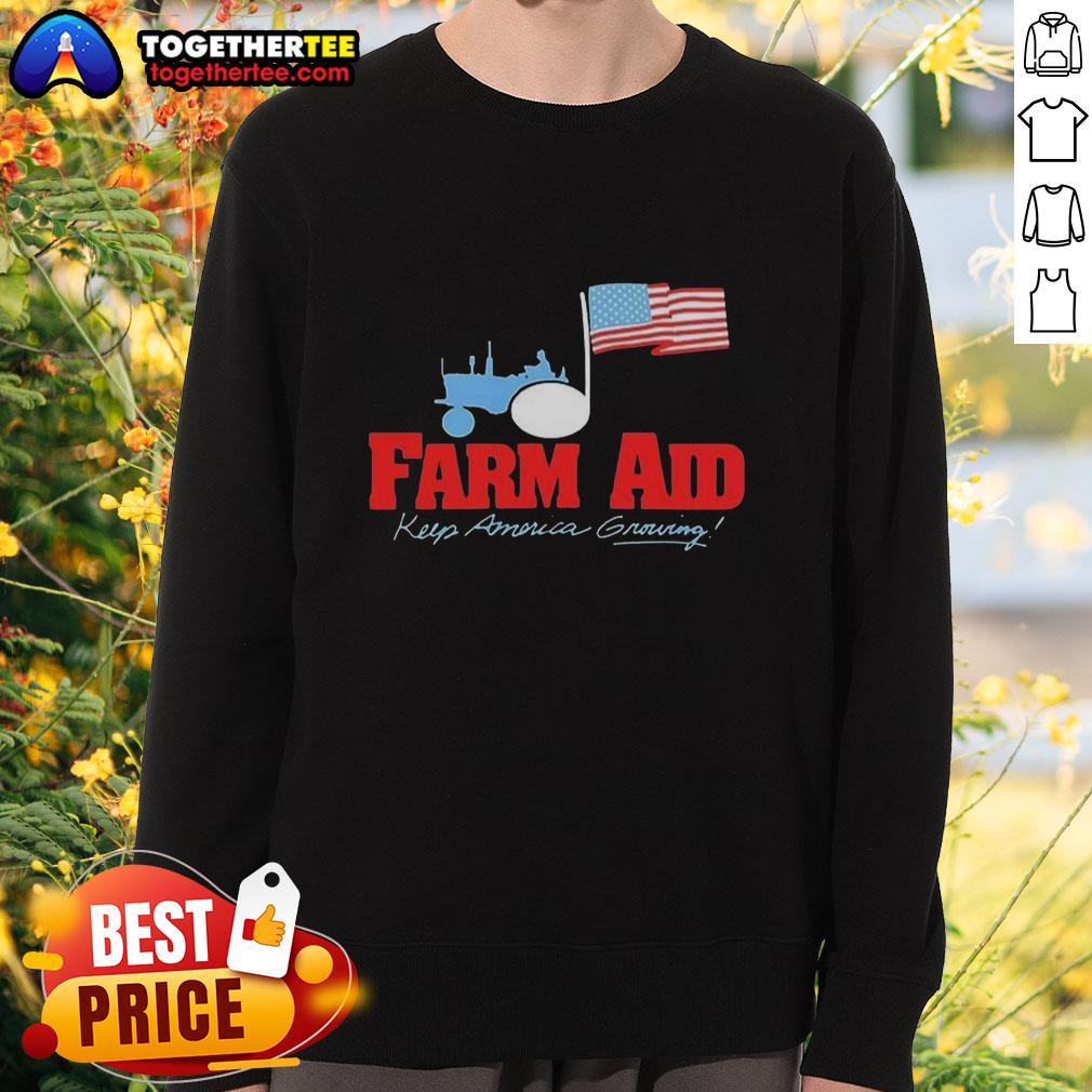 Premium Farm Aid sweatshirt featuring a tractor logo and American flag design, supporting farmers and agriculture.