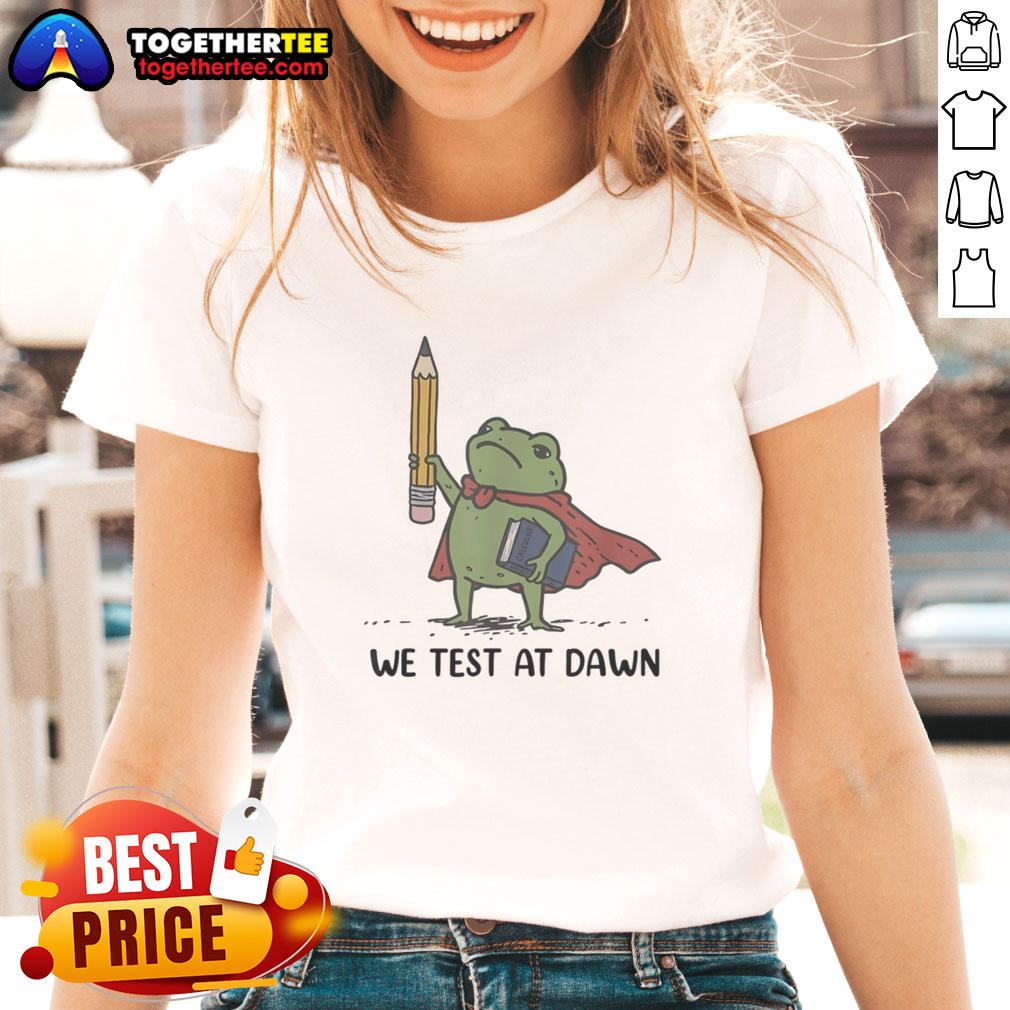 Premium teacher frog holding a giant pencil and calculus book, promoting 'We Test at Dawn' ladies tee design.