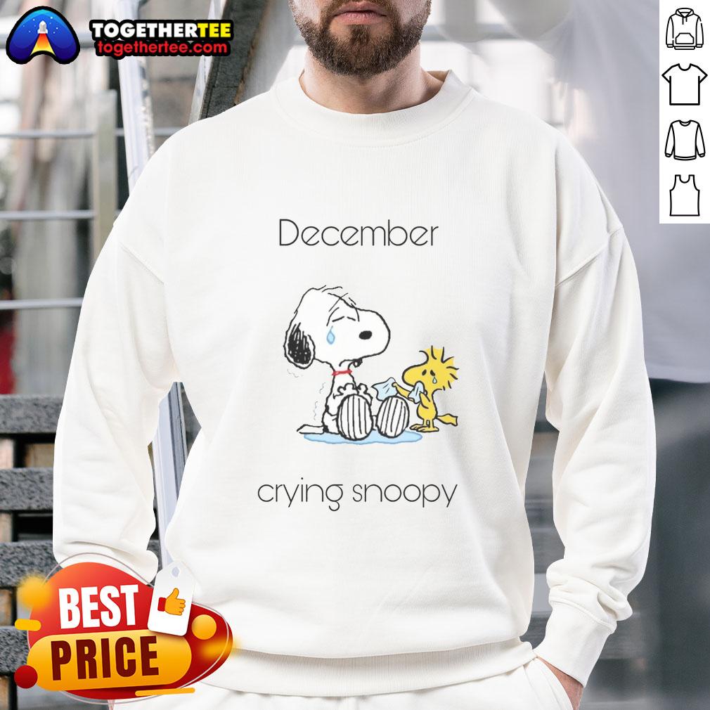 Alt Text: Cozy Pretty December Crying Snoopy Woodstock Sweatshirt featuring cute cartoon characters in winter attire.