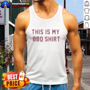 Person wearing 'Top-This-Is-My-BBQ-Tank-Top' at a summer cookout, showcasing a fun BBQ-themed design.