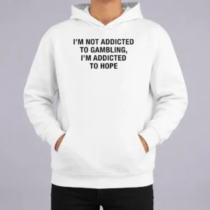 Premium Im Not Addicted To Gambling Im Addicted To Hope Back Print Hoodie in charcoal gray with bold white text on the back