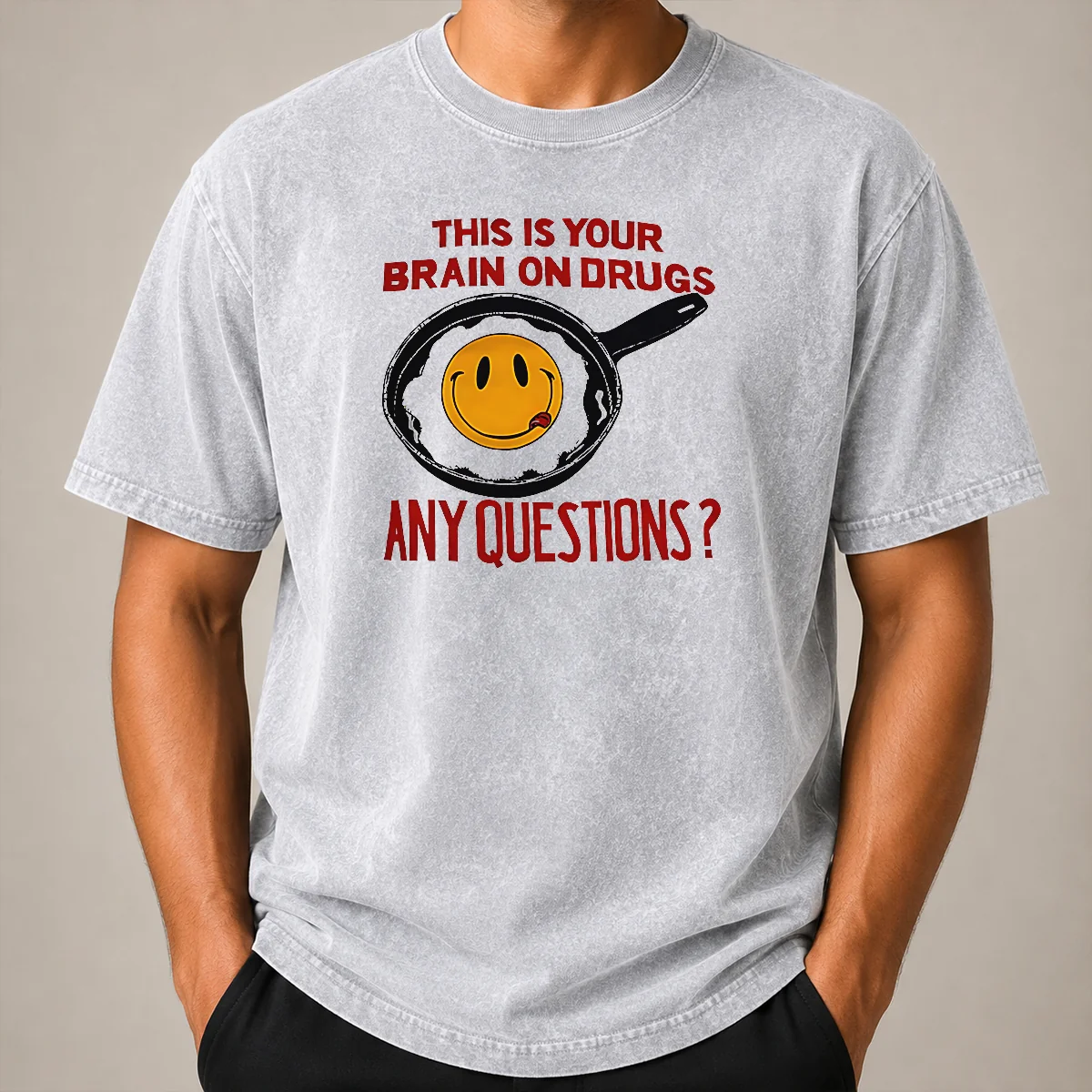 Awesome This Is Your Brain On Drugs Any Questions Fried Egg Smiley Face Washed T Shirt Awesome This Is Your Brain On Drugs Any Questions Fried Egg Smiley Face Washed T Shirt showing front print on soft cotton fabric