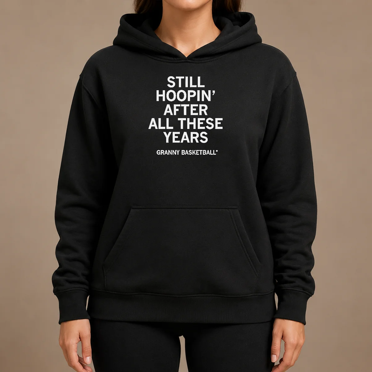 Hot Good Still Hoopin After All These Years Granny Basketball Hoodie Hot Good Still Hoopin After All These Years Granny Basketball Hoodie in black, front view with kangaroo pocket and drawstring hood