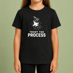 Pretty Official Trust The Process Fighter Jet Paper Airplane Kids T Shirt featuring a fighter jet paper airplane graphic on a children's short sleeve tee